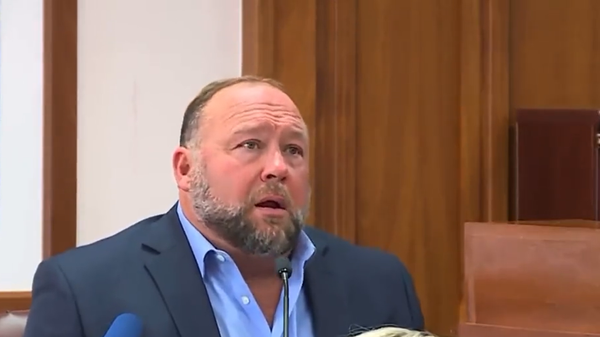 Infowars founder Alex Jones in a Texas court facing defamation charges by a family of a victim of the 2012 Sandy Hook shooting Infowars founder Alex Jones in a Texas court facing defamation charges by a family of a victim of the 2012 Sandy Hook shooting - Sputnik International