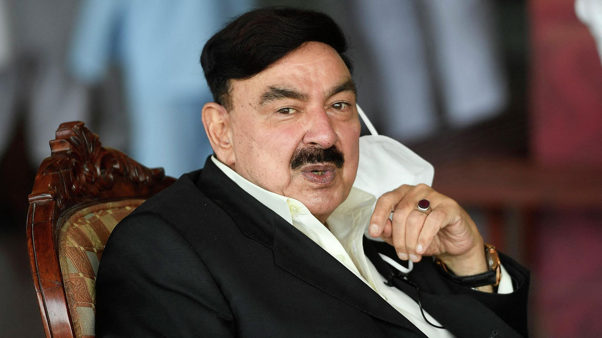 Pakistani Railways Minister Sheikh Rasheed Ahmad sits before speaking to media at the Rawalpindi Railway Station in Rawalpindi on June 26, 2020 Pakistani Railways Minister Sheikh Rasheed Ahmad sits before speaking to media at the Rawalpindi Railway Station in Rawalpindi on June 26, 2020 - Sputnik International, 1920, 04.08.2022