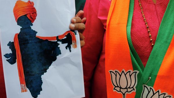 FILE- In this Monday, Aug. 5, 2019 file photo, a participant displays an artist's impression of the India map decorated with a saffron shawl as ruling Bharatiya Janata Party (BJP) supporters celebrate government revoking disputed Kashmir's special status in Prayagraj, India - Sputnik International
