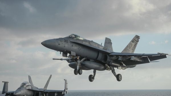 A F/A-18 Hornet lands aboard the nuclear-powered aircraft carrier USS Harry S. Truman, during a visit by Ukraine's Prime Minister Arseniy Yatsenyuk, at an undisclosed position in the Mediterranean Sea, south of Sicily, Thursday, Dec.3, 2015. A F/A-18 Hornet lands aboard the nuclear-powered aircraft carrier USS Harry S. Truman, during a visit by Ukraine's Prime Minister Arseniy Yatsenyuk, at an undisclosed position in the Mediterranean Sea, south of Sicily, Thursday, Dec.3, 2015. - Sputnik International