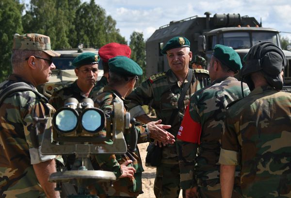 Military personnel of the Syrian team during the firing of T-72B3 tank rounds at the Alabino military training ground in the Moscow region.  - Sputnik International