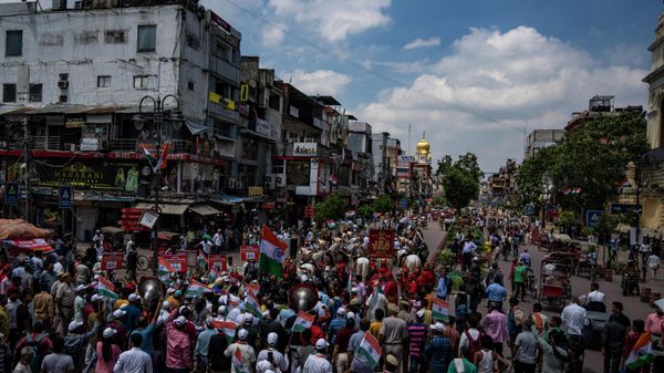 People participate in a 'Tiranga rally or Tricolor flag rally, organized by the ruling Bharatiya Janata Party ahead of India's Independence Day in New Delhi, India, Friday, Aug. 12, 2022. - Sputnik International