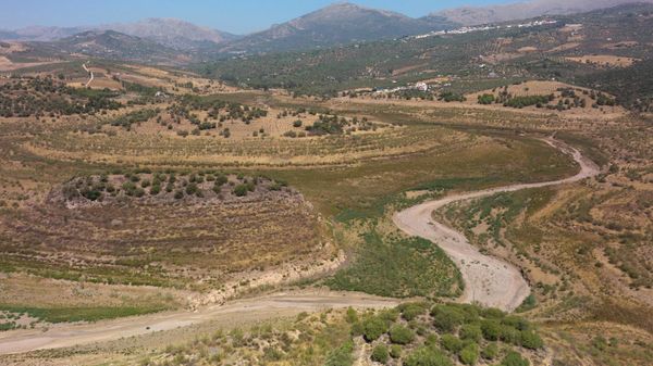 This picture shows a dry land area of La Vinuela reservoir that time ago used to be flooded, in the southern province of Malaga, on August 18, 2022. - Sputnik International