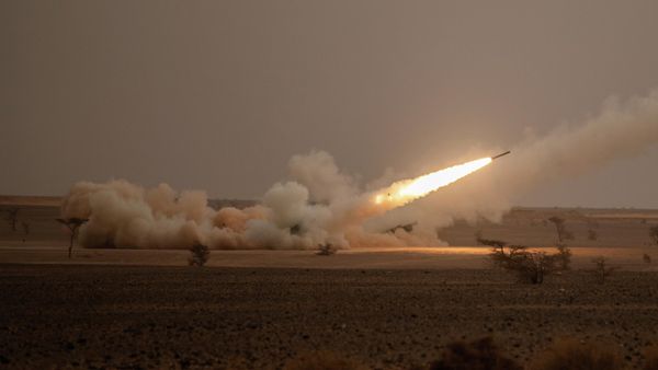 A launch truck fires the High Mobility Artillery Rocket System (HIMARS) at its intended target during the African Lion military exercise in Grier Labouihi complex, southern Morocco, on June 9, 2021. - Sputnik International