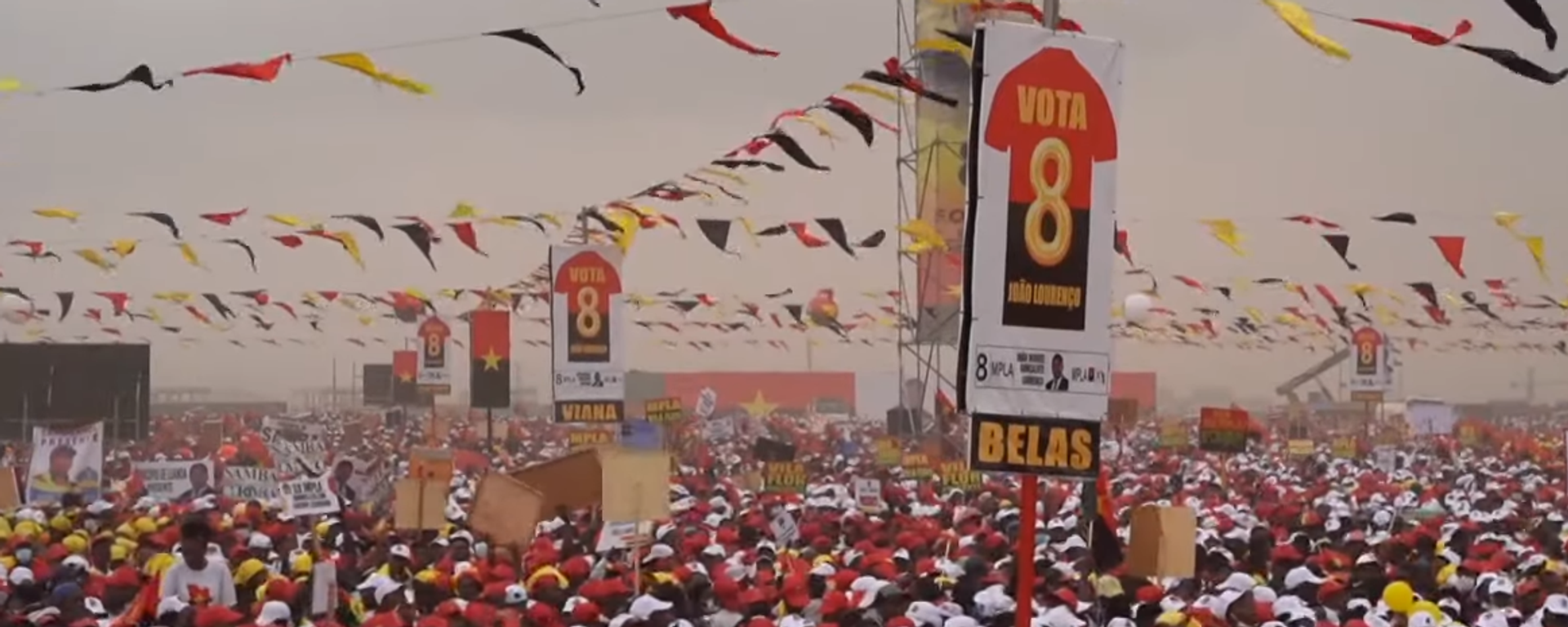 Pro-MPLA rally in Angola on August 22, two days before Wednesday's parliamentary elections. Screengrab of news report. Pro-MPLA rally in Angola on August 22, two days before Wednesday's parliamentary elections. Screengrab of news report. - Sputnik International, 1920, 24.08.2022