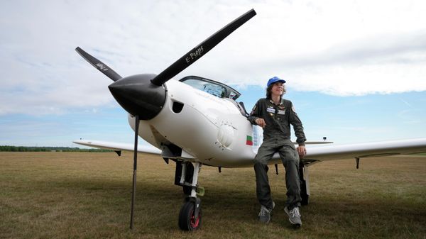 Seventeen year old Anglo-Belgian pilot, Mack Rutherford, poses on the wing of his plane after landing at the Buzet airfield in Pont -A-Celles, Belgium, Tuesday, Aug. 23, 2022 - Sputnik International