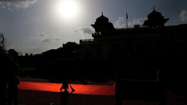 In this Aug. 21, 2015 file photo, an Indian woman worker sweeps the red carpet laid for head of the states and leaders from Pacific Island countries at Rambagh Palace in Jaipur, India. - Sputnik International