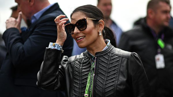 Britain's Home Secretary Priti Patel reacts on the starting grid ahead of the Formula One British Grand Prix at the Silverstone motor racing circuit in Silverstone, central England on July 3, 2022 - Sputnik International