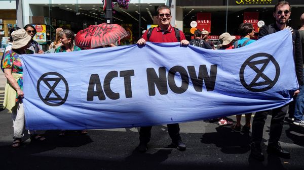 Demonstrators hold a banner as they take part in a protest march from Victoria station to Parliament Square, in London, on July 23, 2022 to demand action over the cost of living crisis - Sputnik International