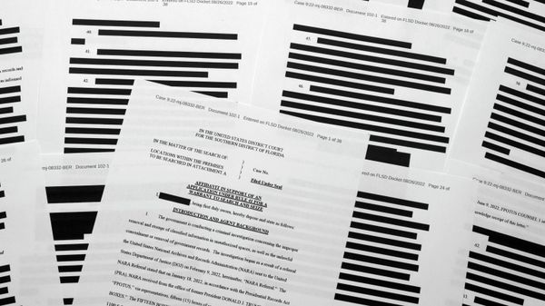 Pages from the affidavit by the FBI in support of obtaining a search warrant for former President Donald Trump's Mar-a-Lago estate are photographed Friday, Aug. 26, 2022.  - Sputnik International