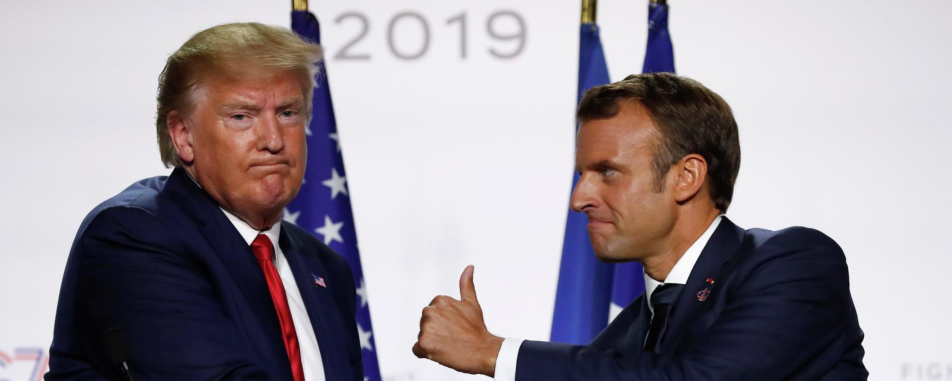 In this Aug. 26, 2019, file photo, French President Emmanuel Macron and U.S President Donald Trump shake hands during the final press conference during the G7 summit in Biarritz, southwestern France. In this Aug. 26, 2019, file photo, French President Emmanuel Macron and U.S President Donald Trump shake hands during the final press conference during the G7 summit in Biarritz, southwestern France. - Sputnik International, 1920, 30.08.2022
