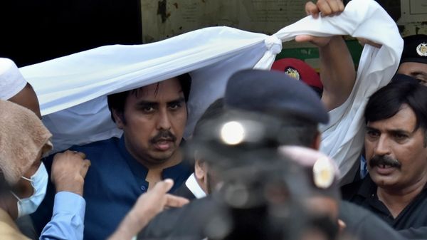 Police officers escort Shahbaz Gill, center in blue shirt, a political aide to former Pakistani prime minister Imran Khan, after a court appearance, in Islamabad, Pakistan, Monday, Aug. 22, 2022.  - Sputnik International