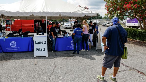 A person stands in line waiting to register for the monkeypox vaccine at a clinic run by the Mecklenburg County Public Health Department in Charlotte, N.C., Saturday, Aug. 20, 2022.  - Sputnik International