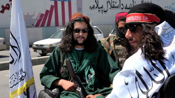 Taliban fighters celebrate the first anniversary of the withdrawal of US-led troops from Afghanistan, in front of the U.S. Embassy in Kabul, Afghanistan, Wednesday, Aug. 31, 2022 - Sputnik International