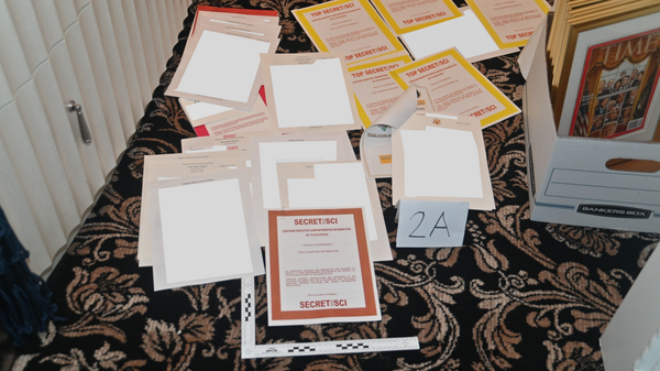 An FBI photo of several classified documents found at Mar-a-Lago during an August 8, 2022, raid. Among them are files marked TOP SECRET/SCI, the highest known level of classification. - Sputnik International