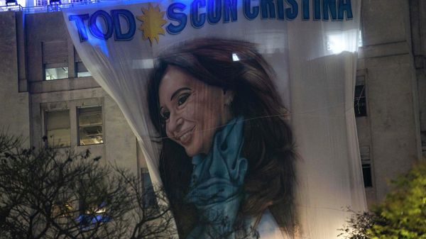 A flag with the portrait of Argentina's Vice President, Cristina Fernandez, hangs from a government building early Friday, Sept. 2, 2022, some hours after a person pointed a gun at her during an event in front of her home in the Recoleta neighborhood of Buenos Aires, Argentina. - Sputnik International