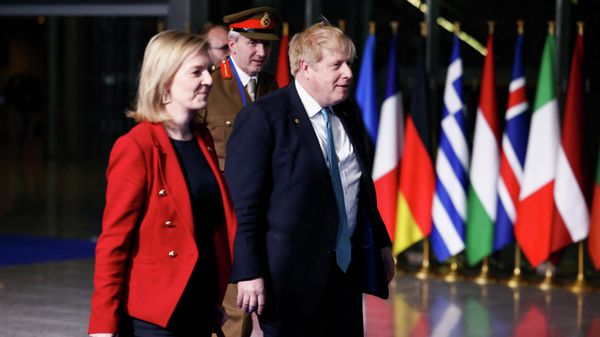 Britain's Prime Minister Boris Johnson (R) Britain's Foreign Secretary Liz Truss (L) and Britain's military representative to NATO Ben Bathurst (REAR) leave NATO Headquarters following a summit  in Brussels on March 24, 2022. - Sputnik International