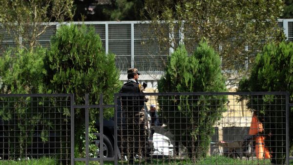 A Taliban fighter stands guard in front of the Russian embassy after a suicide attack in Kabul on September 5, 2022. - Sputnik International