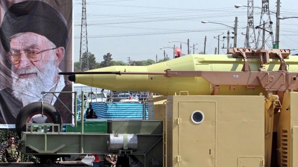 In front of a picture of supreme leader, Ayatollah Ali Khamenei, Iran's Shahab-3 missile, a weapon capable of carrying a nuclear warhead and reaching Europe, Israel and U.S. forces in the Middle East, is displayed during a parade ceremony, marking 25th anniversary of the outset of the Iran-Iraq war (1980-1988) in front of the mausoleum of the late revolutionary founder Ayatollah Ruhollah Khomeini, just outside Tehran, Iran, Thursday, Sept. 22, 2005 In front of a picture of supreme leader, Ayatollah Ali Khamenei, Iran's Shahab-3 missile, a weapon capable of carrying a nuclear warhead and reaching Europe, Israel and U.S. forces in the Middle East, is displayed during a parade ceremony, marking 25th anniversary of the outset of the Iran-Iraq war (1980-1988) in front of the mausoleum of the late revolutionary founder Ayatollah Ruhollah Khomeini, just outside Tehran, Iran, Thursday, Sept. 22, 2005 - Sputnik International