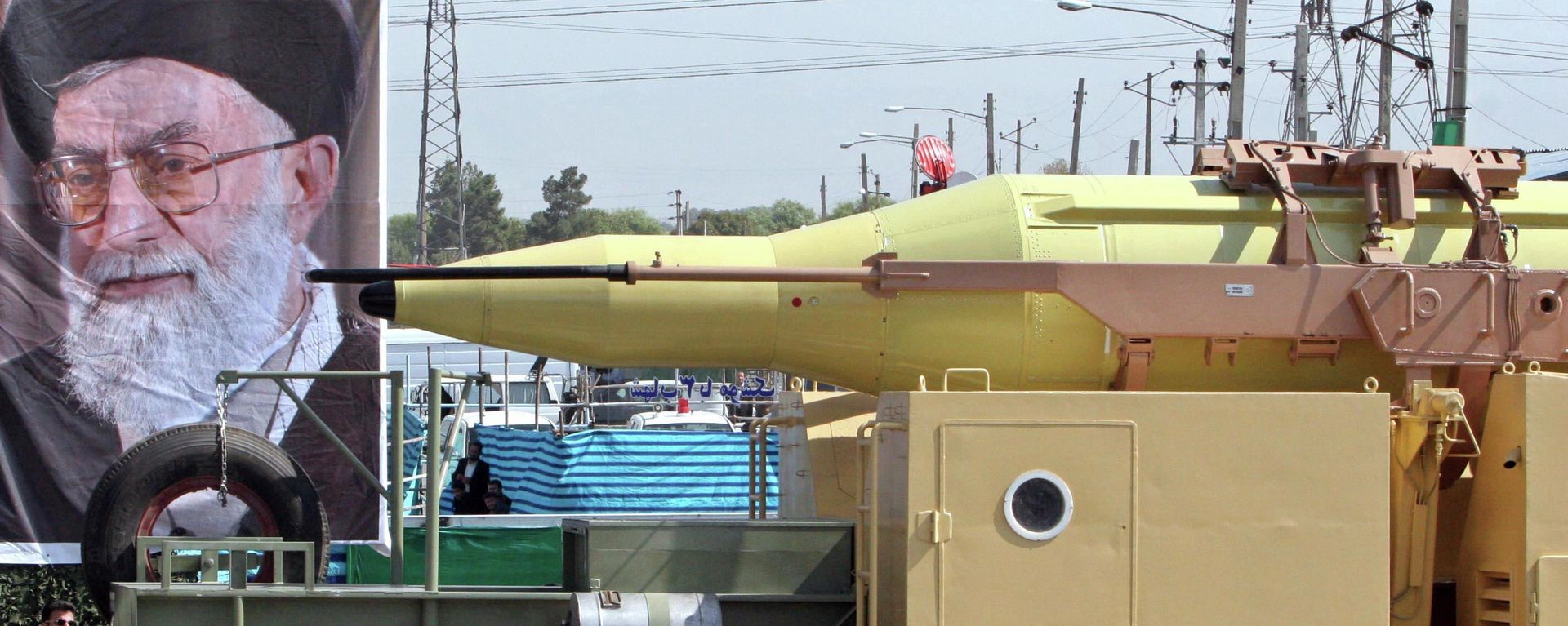 In front of a picture of supreme leader, Ayatollah Ali Khamenei, Iran's Shahab-3 missile, a weapon capable of carrying a nuclear warhead and reaching Europe, Israel and U.S. forces in the Middle East, is displayed during a parade ceremony, marking 25th anniversary of the outset of the Iran-Iraq war (1980-1988) in front of the mausoleum of the late revolutionary founder Ayatollah Ruhollah Khomeini, just outside Tehran, Iran, Thursday, Sept. 22, 2005 - Sputnik International, 1920, 01.07.2025