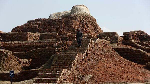 A Pakistani man walks in Mohenjo-daro, a UNESCO World Heritage Site, after heavy rainfall in Larkana District, of Sindh, Pakistan, Tuesday, Sept. 6, 2022 - Sputnik International