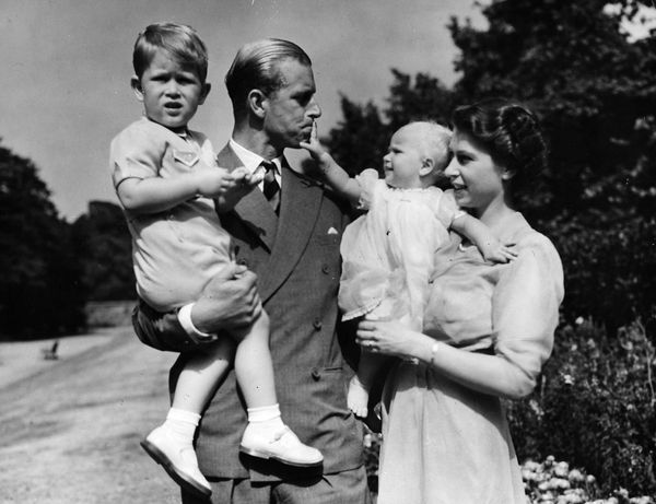 Britain's Queen Elizabeth II, then Princess Elizabeth, stands with her husband Prince Philip, Duke of Edinburgh, and their children. - Sputnik International