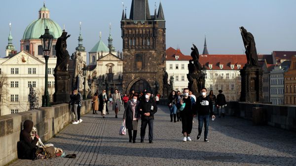 FILE - People wearing face masks walk across the medieval Charles Bridge in Prague, Czech Republic, on Feb. 25, 2021 - Sputnik International