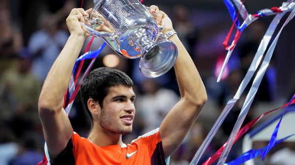 Carlos Alcaraz, of Spain, holds up the championship trophy after defeating Casper Ruud, of Norway, in the men's singles final of the U.S. Open tennis championships, Sunday, Sept. 11, 2022, in New York.  - Sputnik International