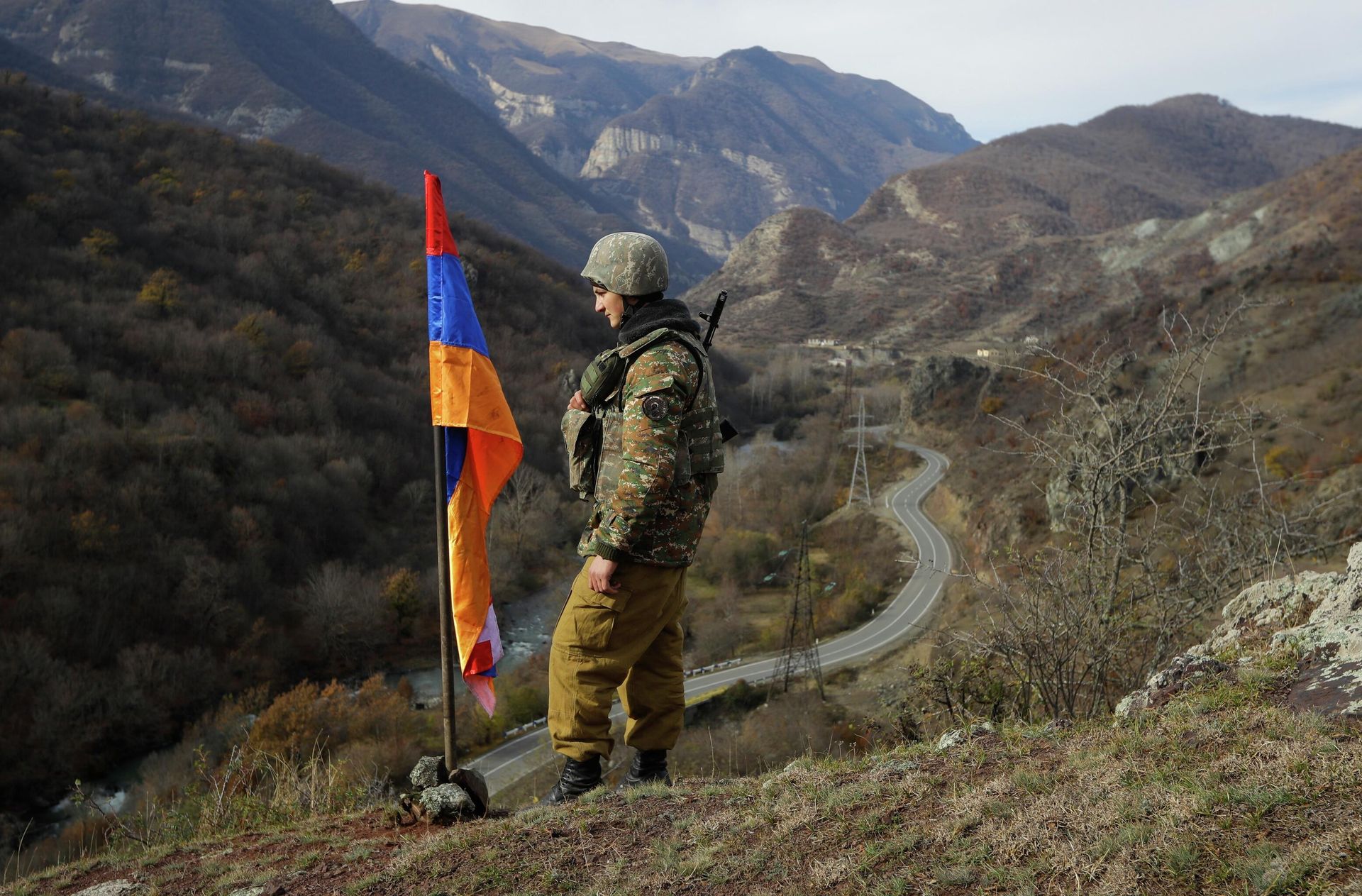 FILE - In this Wednesday, Nov. 25, 2020 file photo, An ethnic Armenian soldier stands guard next to Nagorno-Karabakh's flag atop of the hill near Charektar , Nov. 25, 2020 FILE - In this Wednesday, Nov. 25, 2020 file photo, An ethnic Armenian soldier stands guard next to Nagorno-Karabakh's flag atop of the hill near Charektar , Nov. 25, 2020 - Sputnik International, 1920, 20.09.2023