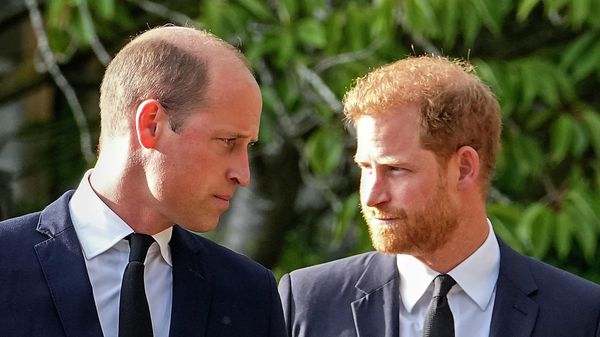 Britain's Prince William and Britain's Prince Harry walk beside each other after viewing the floral tributes for the late Queen Elizabeth II outside Windsor Castle - Sputnik International
