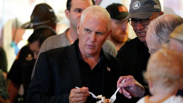 Former Vice President Mike Pence eats a pork picnic in a cup in the Iowa Pork Producers tent during a visit to the Iowa State Fair, Friday, Aug. 19, 2022, in Des Moines, Iowa Former Vice President Mike Pence eats a pork picnic in a cup in the Iowa Pork Producers tent during a visit to the Iowa State Fair, Friday, Aug. 19, 2022, in Des Moines, Iowa - Sputnik International