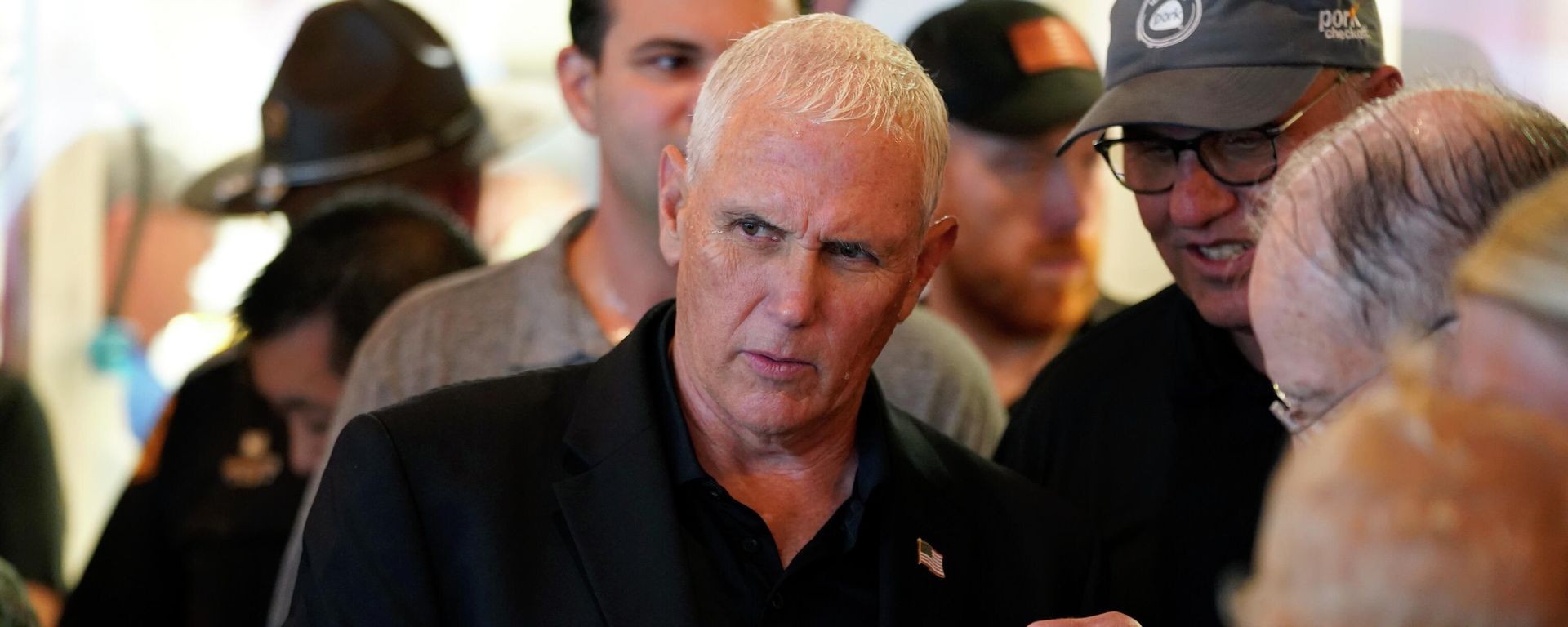Former Vice President Mike Pence eats a pork picnic in a cup in the Iowa Pork Producers tent during a visit to the Iowa State Fair, Friday, Aug. 19, 2022, in Des Moines, Iowa - Sputnik International, 1920, 13.09.2022