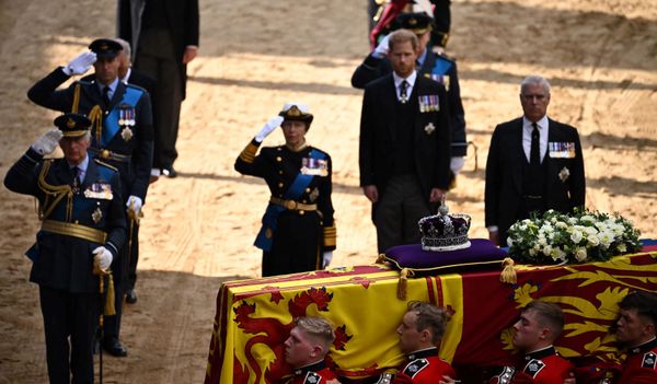 Britain's King Charles III, Britain's Prince William, Prince of Wales and Britain's Princess Anne, Princess Royal salute, alongside Britain's Prince William, Prince of Wales and Britain's Prince Andrew, Duke of York as the coffin of Queen Elizabeth II, adorned with a Royal Standard and the Imperial State Crown, arrives at the Palace of Westminster, following a procession from Buckingham Palace, in London on September 14, 2022. - Queen Elizabeth II will lie in state in Westminster Hall inside the Palace of Westminster, from Wednesday until a few hours before her funeral on Monday, with huge queues expected to file past her coffin to pay their respects. - Sputnik International