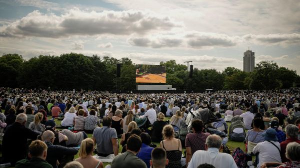 People watch a screen broadcasting the procession of the coffin of Queen Elizabeth II from Buckingham Palace to Westminster Hall, London, Wednesday Sept. 14, 2022. The Queen will lie in state in Westminster Hall for four full days before her funeral on Monday Sept. 19. People watch a screen broadcasting the procession of the coffin of Queen Elizabeth II from Buckingham Palace to Westminster Hall, London, Wednesday Sept. 14, 2022. The Queen will lie in state in Westminster Hall for four full days before her funeral on Monday Sept. 19. - Sputnik International