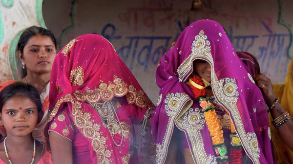 An underaged bride, right, stands with family members during her marriage at a Hindu temple (File) - Sputnik International
