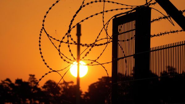 Barbed wir secure the entrance of the harbour area where the landfall of the Nord Stream 1 Baltic Sea pipeline located, as the sun rises behind the pipeline facility and the transfer station of the OPAL gas pipeline, the Baltic Sea Pipeline Link, in Lubmin, Germany, Thursday, July 21, 2022. Europe is bracing for the possibility that the key Nord Stream 1 pipeline that brings natural gas from Russia to Germany won't reopen as scheduled after routine maintenance. (AP Photo/Markus Schreiber) Barbed wir secure the entrance of the harbour area where the landfall of the Nord Stream 1 Baltic Sea pipeline located, as the sun rises behind the pipeline facility and the transfer station of the OPAL gas pipeline, the Baltic Sea Pipeline Link, in Lubmin, Germany, Thursday, July 21, 2022. Europe is bracing for the possibility that the key Nord Stream 1 pipeline that brings natural gas from Russia to Germany won't reopen as scheduled after routine maintenance. (AP Photo/Markus Schreiber) - Sputnik International