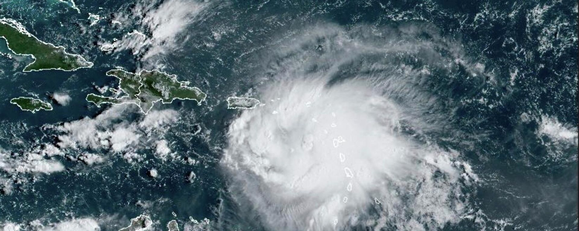 This satellite image provided by NOAA shows Tropical Storm Fiona in the Caribbean on Saturday, Sept. 17, 2022. Fiona threatened to dump up to 16 inches (41 centimeters) of rain in parts of Puerto Rico on Saturday as forecasters placed the U.S. territory under a hurricane watch and people braced for potential landslides, severe flooding and power outages. This satellite image provided by NOAA shows Tropical Storm Fiona in the Caribbean on Saturday, Sept. 17, 2022. Fiona threatened to dump up to 16 inches (41 centimeters) of rain in parts of Puerto Rico on Saturday as forecasters placed the U.S. territory under a hurricane watch and people braced for potential landslides, severe flooding and power outages. - Sputnik International, 1920, 24.09.2022
