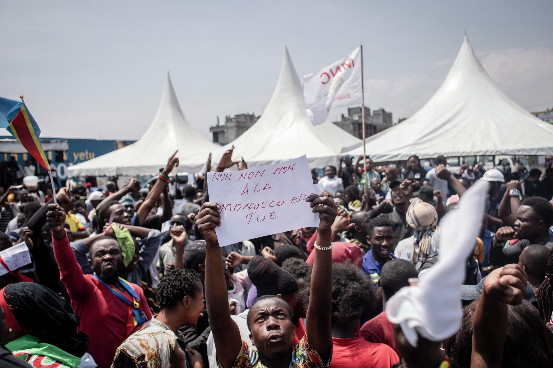 A man holds a placard during the burial of activists, who died during demonstrations that took place in Goma from July 25 to 27 to demand the departure of United Nations Organization Stabilization Mission in the Democratic Republic of the Congo (MONUSCO), in Goma on August 5, 2022. - Ten people who died in protests against the UN Mission that recently rocked towns in eastern Democratic Republic of Congo were laid to rest in Goma on August 5, 2022 after a popular tribute ceremony.
At the end of July, angry demonstrators ransacked and looted facilities of the United Nations Mission for the Stabilization of the DRC (Monusco), present in the country since 1999.
A total of 32 demonstrators and four peacekeepers were killed in a week of demonstrations in at least four eastern towns. (Photo by Guerchom Ndebo / AFP) A man holds a placard during the burial of activists, who died during demonstrations that took place in Goma from July 25 to 27 to demand the departure of United Nations Organization Stabilization Mission in the Democratic Republic of the Congo (MONUSCO), in Goma on August 5, 2022. - Ten people who died in protests against the UN Mission that recently rocked towns in eastern Democratic Republic of Congo were laid to rest in Goma on August 5, 2022 after a popular tribute ceremony.
At the end of July, angry demonstrators ransacked and looted facilities of the United Nations Mission for the Stabilization of the DRC (Monusco), present in the country since 1999.
A total of 32 demonstrators and four peacekeepers were killed in a week of demonstrations in at least four eastern towns. (Photo by Guerchom Ndebo / AFP) - Sputnik International, 1920, 19.09.2022