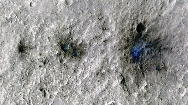 This undated photo released by NASA shows craters that were formed by a Sept. 5, 2021, meteoroid impact on Mars, the first to be detected by NASA’s InSight - Sputnik International