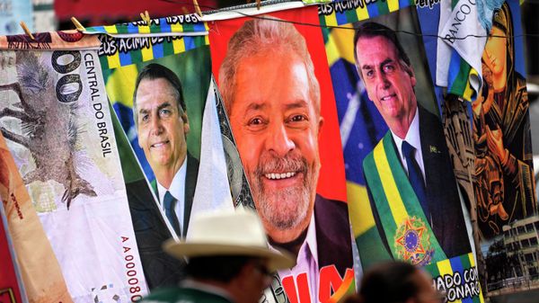 FILE - Towels with images of Brazilian presidential candidates, President Jair Bolsonaro and former President Luiz Inacio Lula da Silva, are for sale by a street vendor, hanging from a makeshift clothesline in Brasilia, Brazil, Thursday, Sept. 22, 2022. Despite the smoke clogging the air of entire Amazon cities, state elections have largely ignored environmental issues.  - Sputnik International