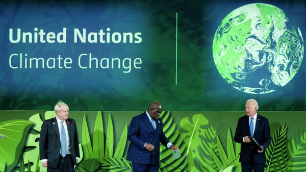 British Prime Minister Boris Johnson, President of Congo Felix Tshisekedi and President Joe Biden stand before speaking at a session on Action on Forests and Land Use, during the UN Climate Change Conference COP26 in Glasgow, Scotland, Tuesday, Nov. 2, 2021.  (Erin Schaff/The New York Times via AP, Pool) - Sputnik International