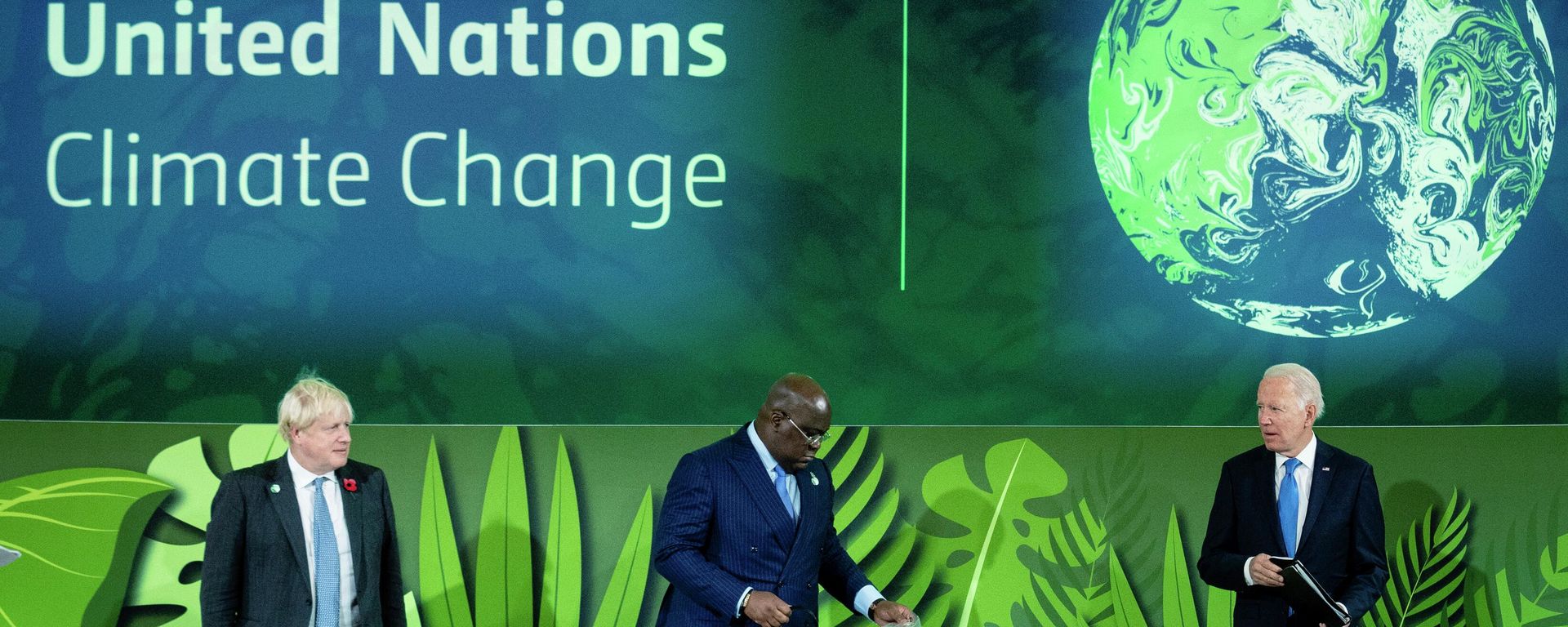 British Prime Minister Boris Johnson, President of Congo Felix Tshisekedi and President Joe Biden stand before speaking at a session on Action on Forests and Land Use, during the UN Climate Change Conference COP26 in Glasgow, Scotland, Tuesday, Nov. 2, 2021. (Erin Schaff/The New York Times via AP, Pool) British Prime Minister Boris Johnson, President of Congo Felix Tshisekedi and President Joe Biden stand before speaking at a session on Action on Forests and Land Use, during the UN Climate Change Conference COP26 in Glasgow, Scotland, Tuesday, Nov. 2, 2021. (Erin Schaff/The New York Times via AP, Pool) - Sputnik International, 1920, 03.10.2022