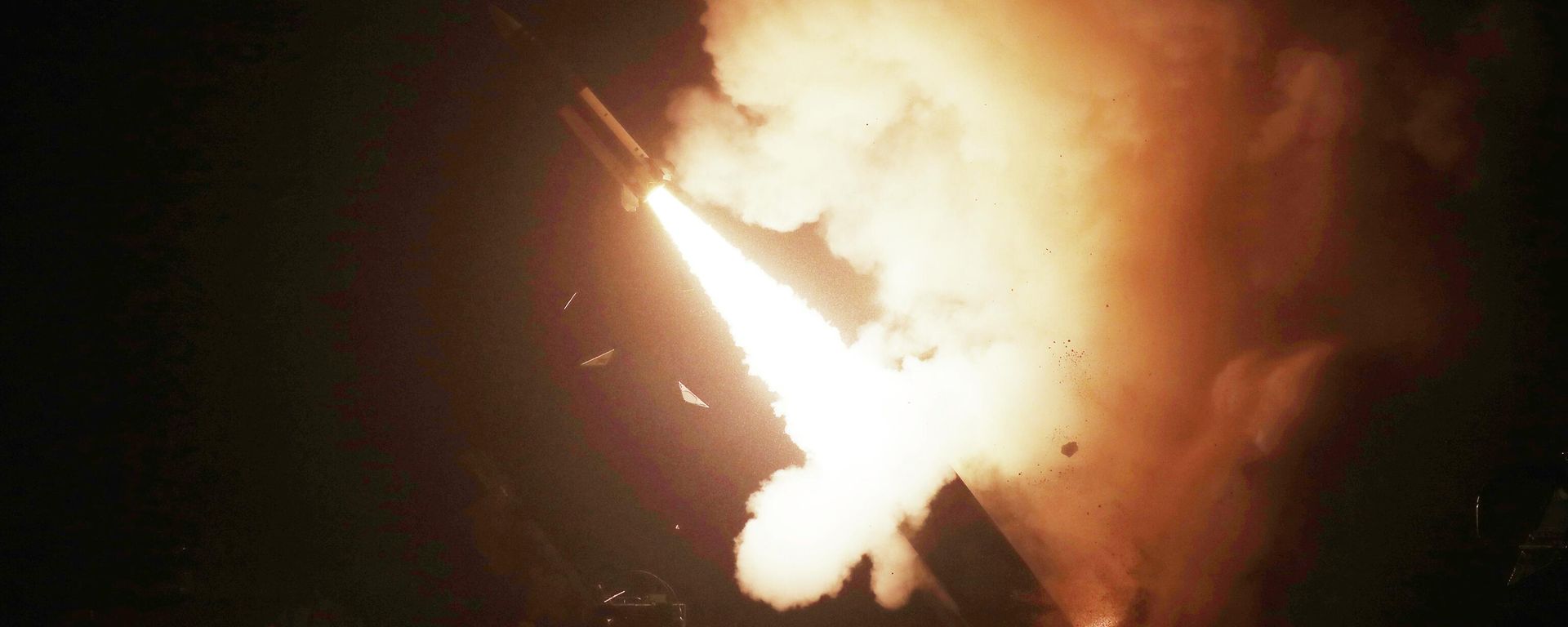 An Army Tactical Missile System (ATACMS) missile is fired during a military drill  - Sputnik International, 1920, 23.06.2024
