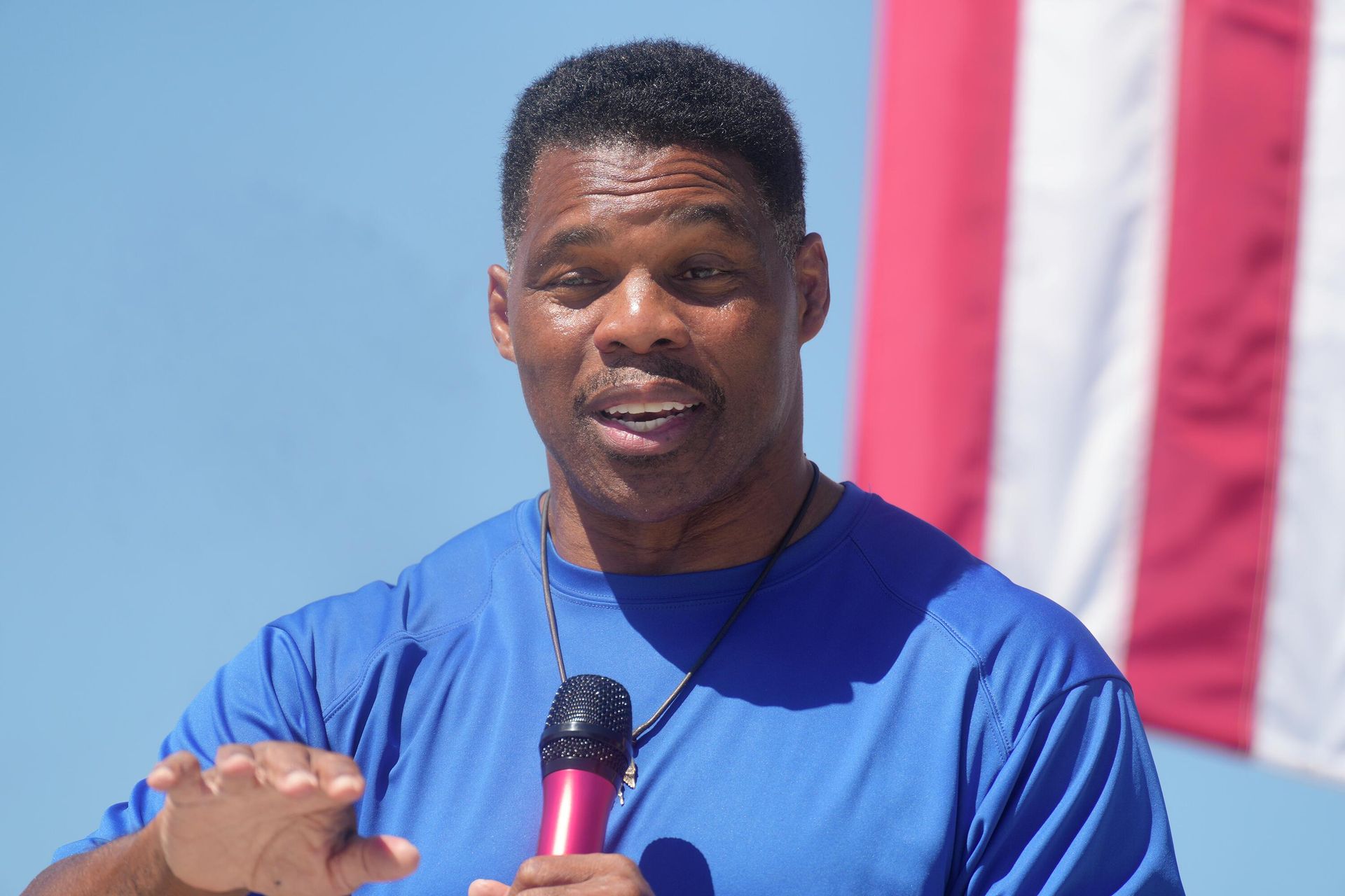 Georgia GOP Senate nominee Herschel Walker smiles during remarks during a campaign stop at Battle Lumber Co. on Thursday, Oct. 6, 2022, in Wadley, Ga. Walker's appearance was his first following reports that a woman who said Walker paid for her 2009 abortion is actually mother of one of his children - undercutting Walker's claims he didn't know who she was. Georgia GOP Senate nominee Herschel Walker smiles during remarks during a campaign stop at Battle Lumber Co. on Thursday, Oct. 6, 2022, in Wadley, Ga. Walker's appearance was his first following reports that a woman who said Walker paid for her 2009 abortion is actually mother of one of his children - undercutting Walker's claims he didn't know who she was. - Sputnik International, 1920, 06.12.2022