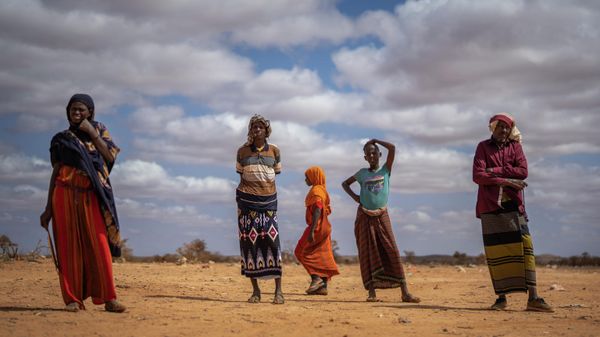Men and women stand at a camp for displaced people on the outskirts of Dollow, Somalia, on Monday, Sept. 19, 2022. - Sputnik International