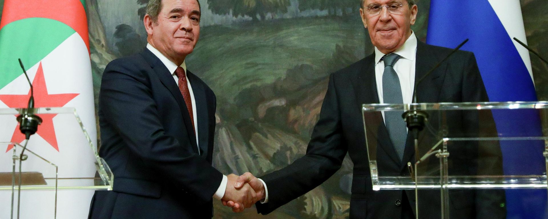 In this photo distributed by Russian Foreign Ministry Press Service, Russian Foreign Minister Sergey Lavrov, right, and Algerian Foreign Minister Sabri Boukadoum shake hands as they leave a joint news conference following their talks in Moscow, Russia on Wednesday, July 22, 2020. In this photo distributed by Russian Foreign Ministry Press Service, Russian Foreign Minister Sergey Lavrov, right, and Algerian Foreign Minister Sabri Boukadoum shake hands as they leave a joint news conference following their talks in Moscow, Russia on Wednesday, July 22, 2020. - Sputnik International, 1920, 10.10.2022
