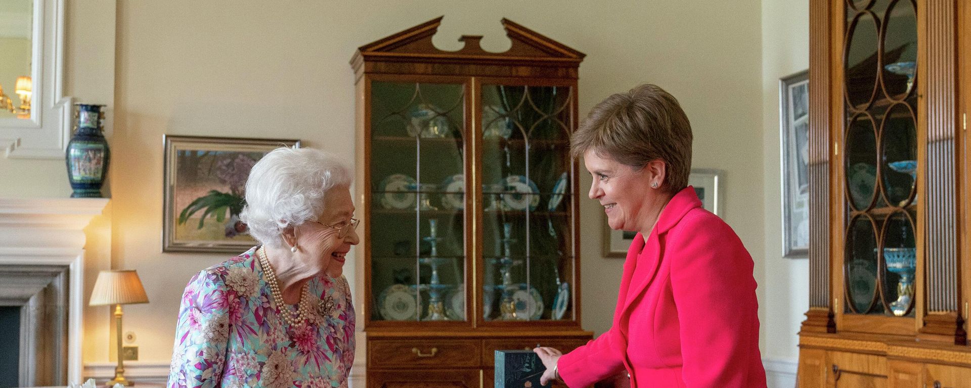 Britain's late Queen Elizabeth II, left, receives First Minister of Scotland Nicola Sturgeon Britain's late Queen Elizabeth II, left, receives First Minister of Scotland Nicola Sturgeon - Sputnik International, 1920, 11.10.2022