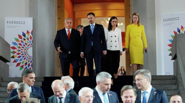 From top left, Hungary's Prime Minister Viktor Orban, Slovakia's Prime Minister Eduard Heger, Finland's Prime Minister Sanna Marin and Estonia's Prime Minister Kaja Kallas arrive for a group photo of EU leaders during an EU Summit at Prague Castle in Prague, Czech Republic, Friday, Oct 7, 2022.  - Sputnik International