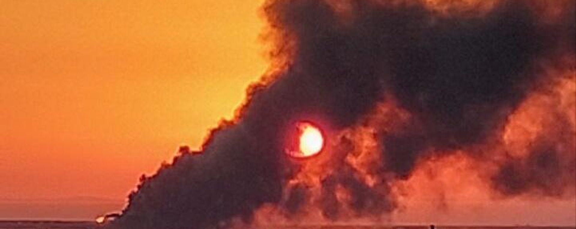 A view shows a smoke rising from a fire on Crimean Bridge connecting Russian mainland and Crimean peninsula over the Kerch Strait, in Crimea, Russia.  - Sputnik International, 1920, 15.10.2022