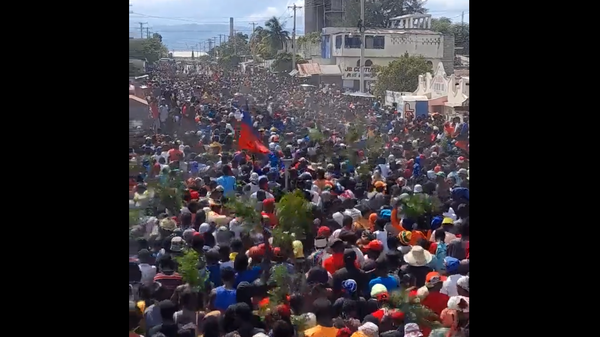 Thousands of demonstrators protest in the Cite Soleil neighborhood of Port-au-Prince, Haiti, on October 12, 2022, against a possible new intervention by foreign troops. They also called for the resignation of Acting Prime Minister Ariel Henry. - Sputnik International